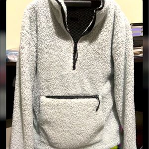 It is a white fur jacket, it has no hood.